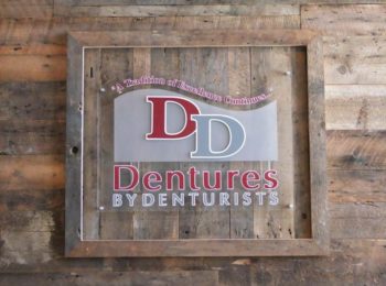 Dentures By Denturists wall logo